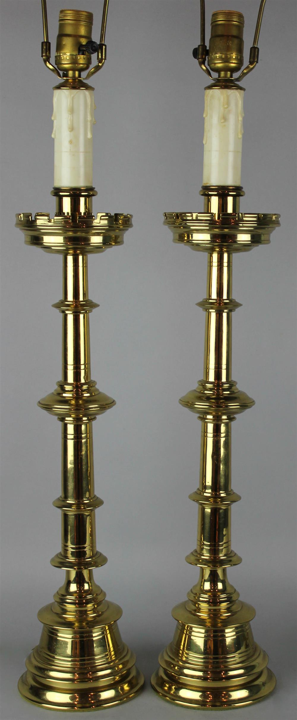 Appraisal: PAIR OF BRASS CANDLESTICK LAMPS ELECTRIFIED baluster form with shaped