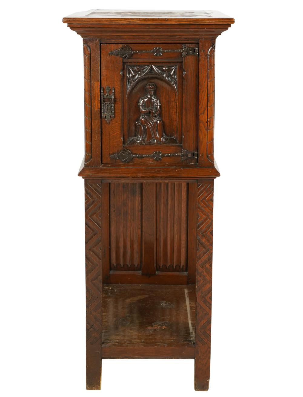 Appraisal: TUDOR STYLE CARVED OAK CABINETthe hinged door relief-carved with a