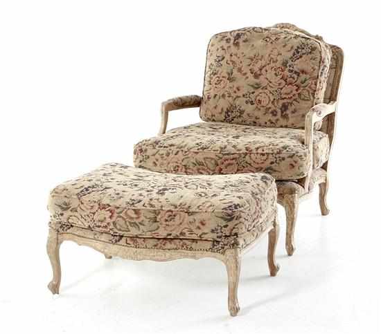 Appraisal: Louis XV style fauteuil and ottoman scrolling carved frame with