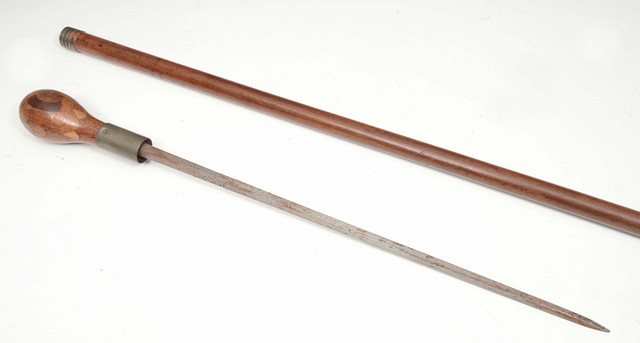 Appraisal: AN OLD MAHOGANY SWORD STICK with decoratively turned inlaid ovoid