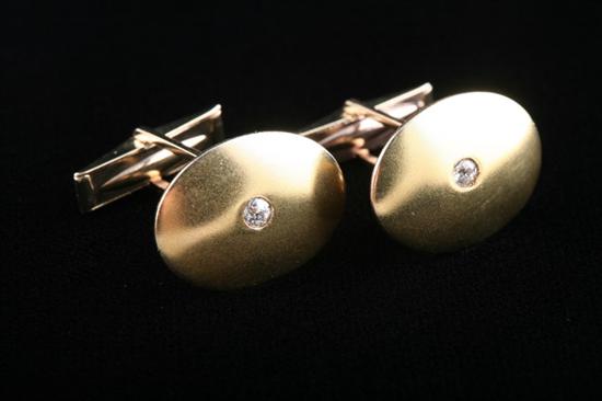 Appraisal: PAIR VINTAGE K YELLOW GOLD AND DIAMOND CUFFLINKS Oval matte-finish