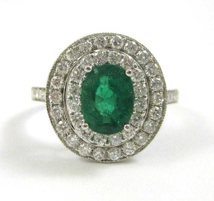 Appraisal: EMERALD DIAMOND AND FOURTEEN KARAT GOLD RING The white gold