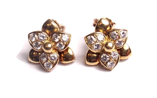 Appraisal: A pair of gold and diamond set earstuds each designed