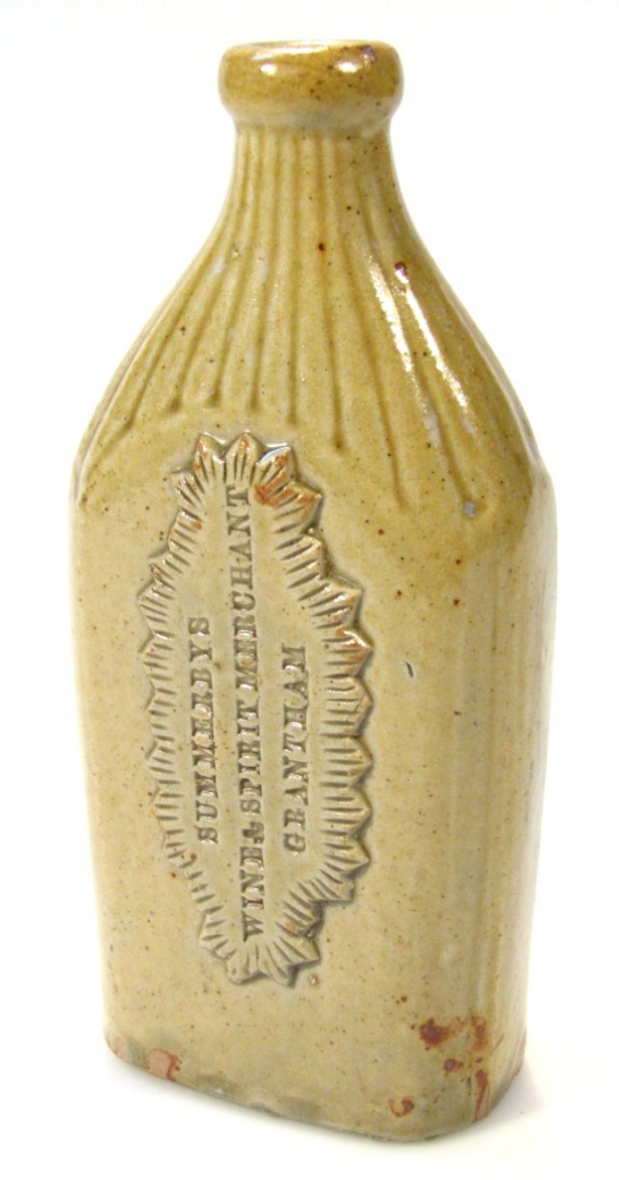 Appraisal: A glazed stoneware bottle the shouldered body part fluted and