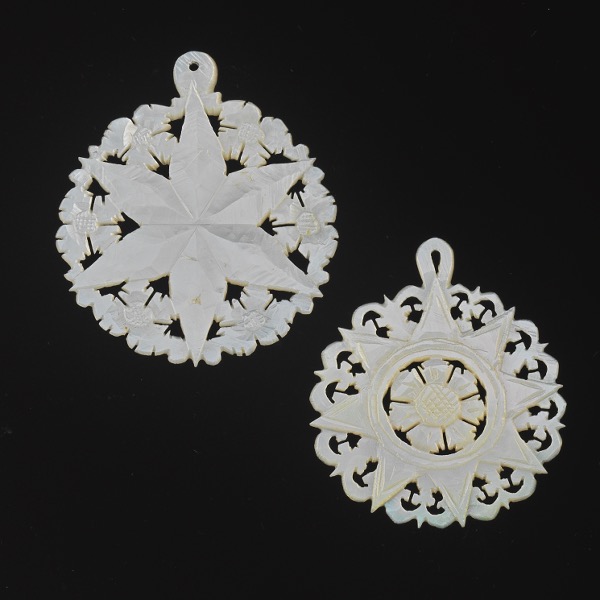 Appraisal: SET OF TWO VINTAGE CARVED MOTHER OF PEARL STAR OF