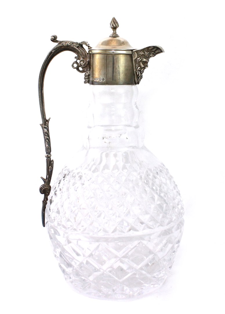 Appraisal: A modern silver mounted faceted glass claret jug with a