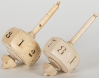 Appraisal: Pair of Ivory Put Take Tops with Numerals Circa The