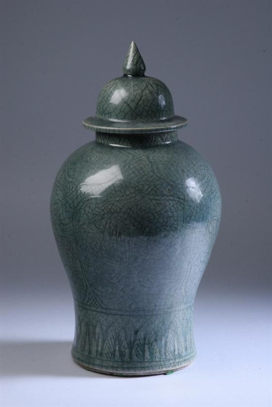 Appraisal: JAPANESE OR THAI CELADON BALUSTER VASE AND COVER Floral decoration