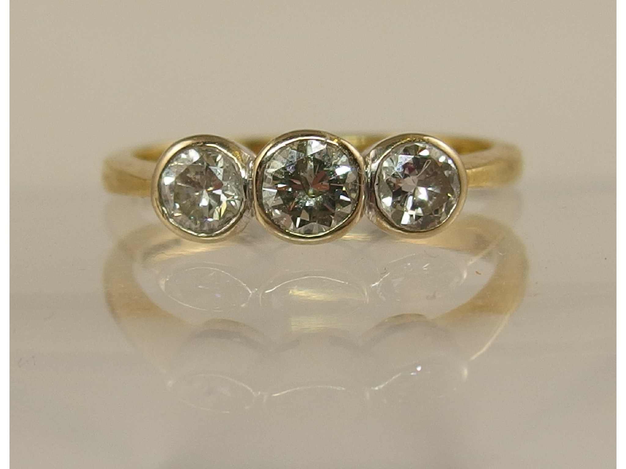 Appraisal: An ct yellow gold three stone diamond ring of approx