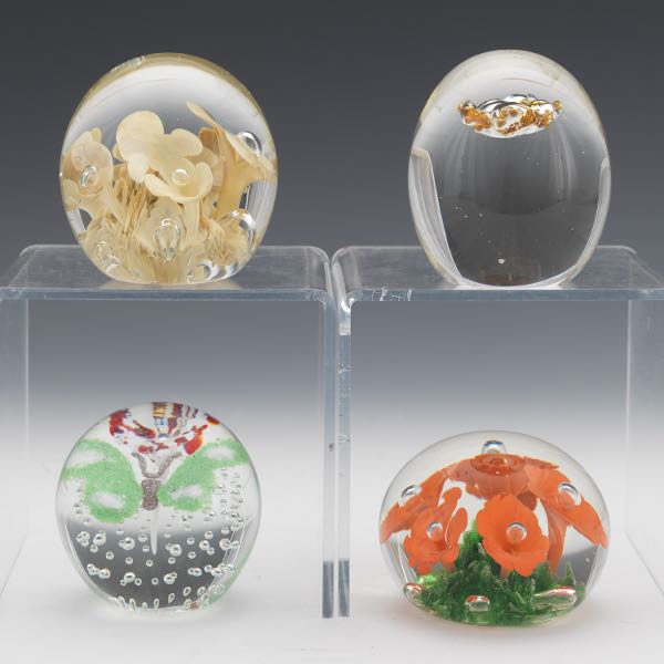 Appraisal: FOUR GLASS PAPERWEIGHTS Including a Querandi Argentina paperweight free-form with