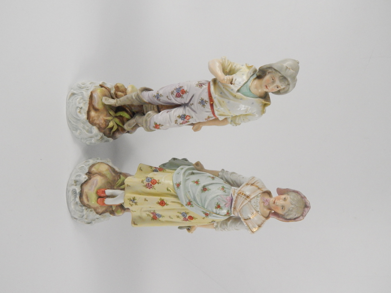 Appraisal: A pair of Rudolstadt late thC porcelain figural spill vases