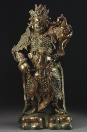 Appraisal: Standing figure holding a jewel in his left hand and