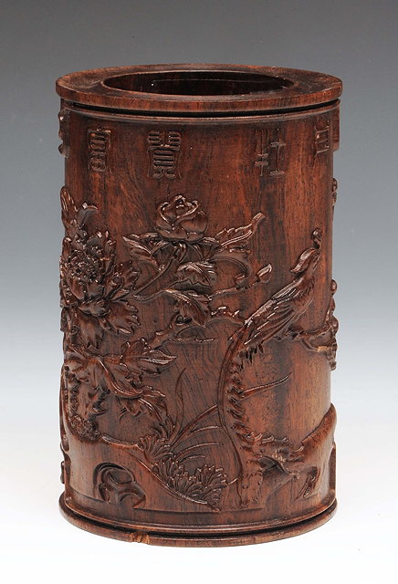 Appraisal: A Chinese hardwood bitongcarved in relief with poem peonies exotic