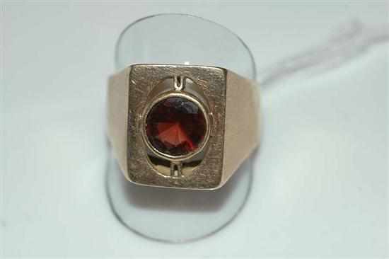 Appraisal: A GARNET SET DRESS RING STAMPED CT GOLD