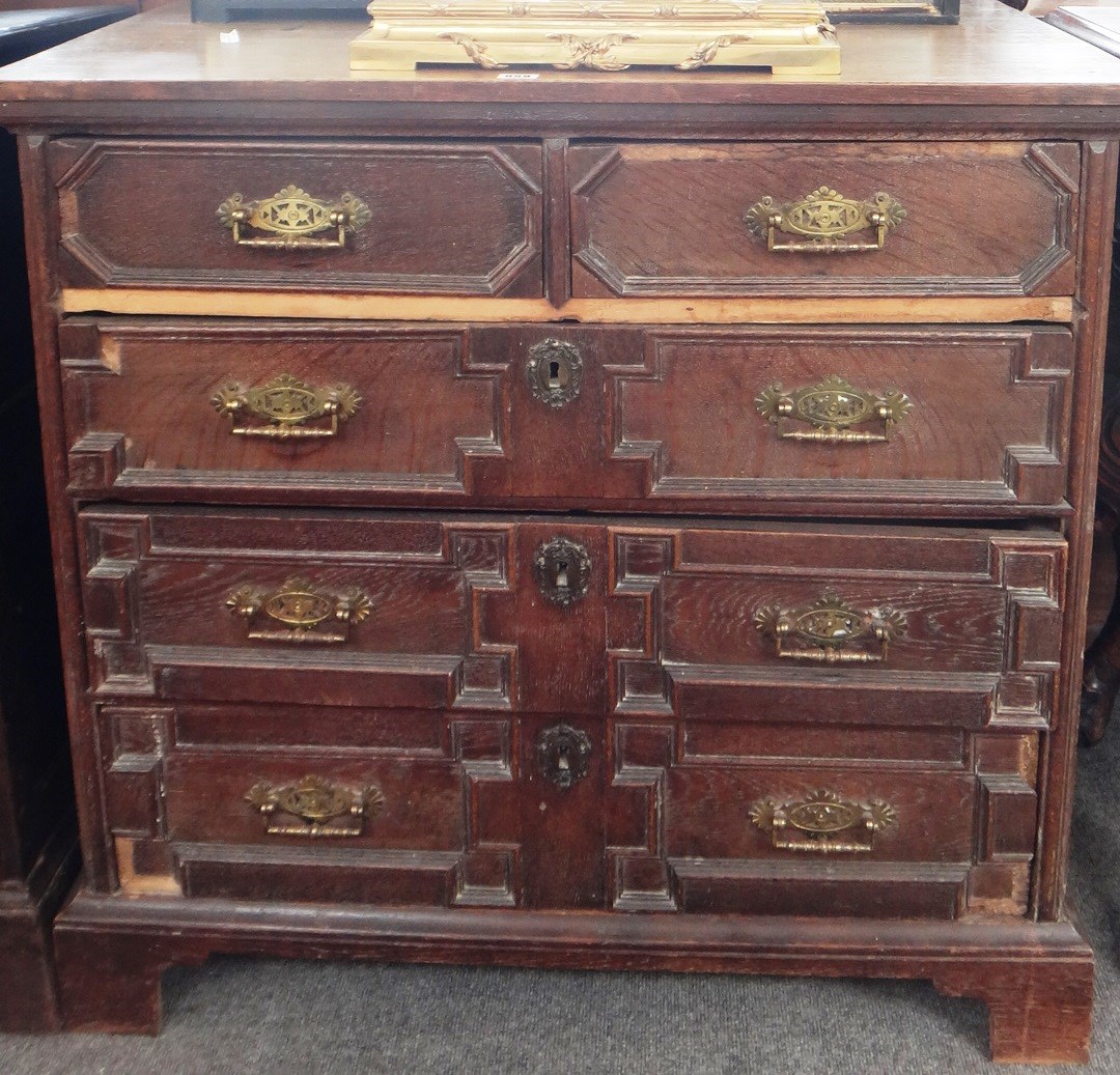 Appraisal: A late th century oak chest of two short and