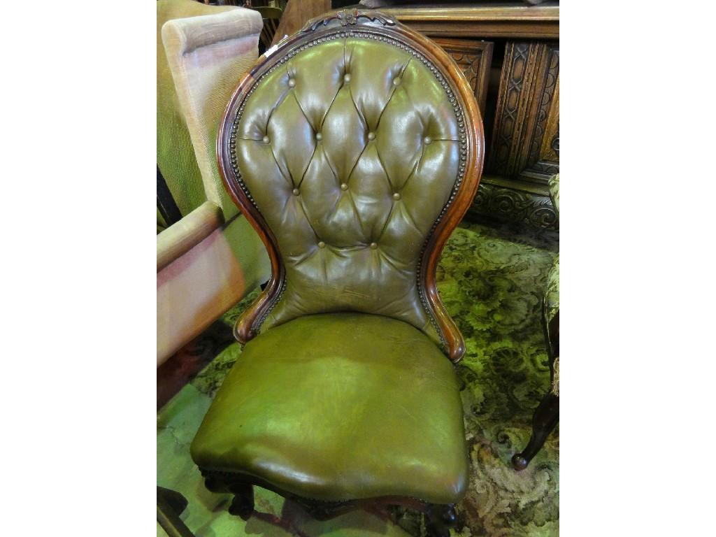 Appraisal: A Victorian spoon back drawing room chair with green leather