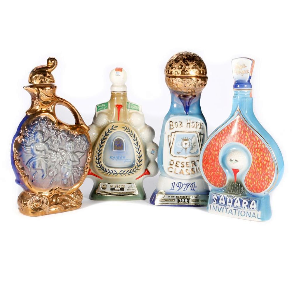 Appraisal: Three Jim Beam commemorative bottles and an unattributed bottle Four