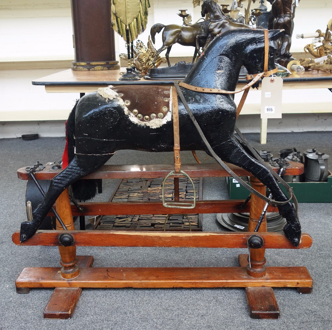 Appraisal: A black painted wooden rocking horse th century later alterations