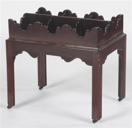 Appraisal: A George III mahogany decanter stand the six division top