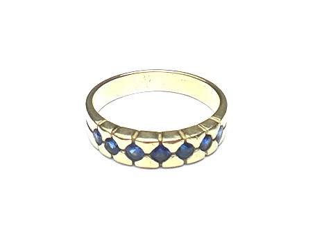 Appraisal: A gold and sapphire set seven stone half hoop ring