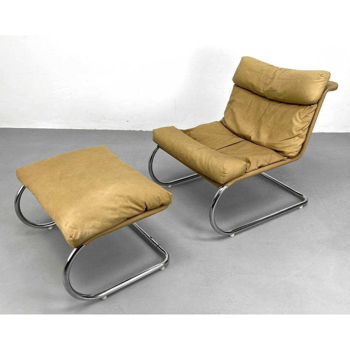 Appraisal: Chrome and Canvas Lounge Chair and Ottoman Dimensions H inches