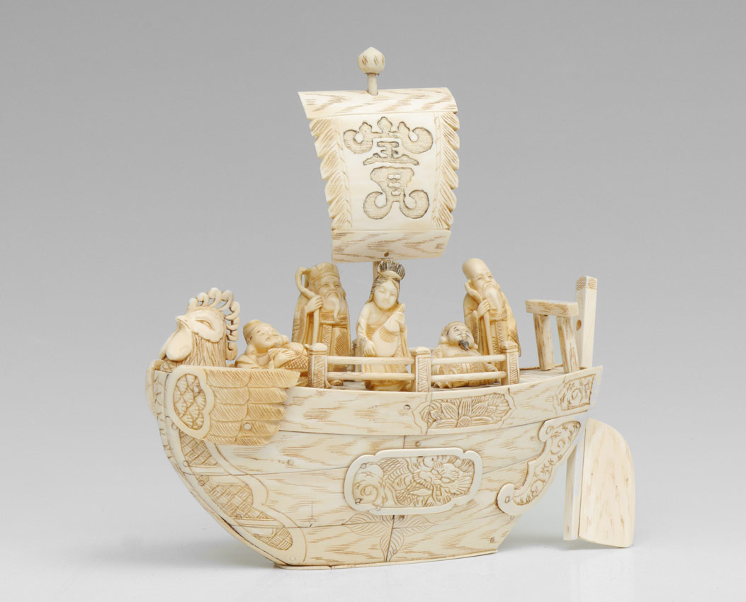 Appraisal: CARVED IVORY BOAT WITH IMMORTALS Clad carved ivory boat with