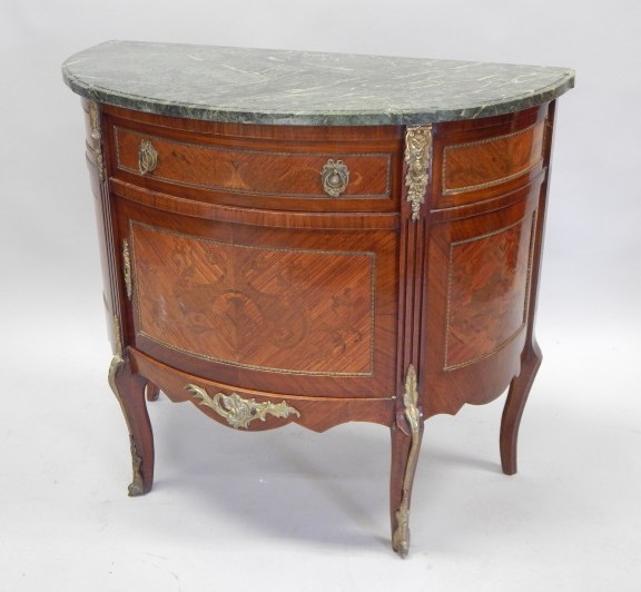 Appraisal: A thC continental mahogany demi lune side cabinet with a