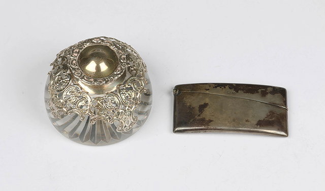 Appraisal: A SILVER MOUNTED GLASS INKWELL with pierced scroll and foliate