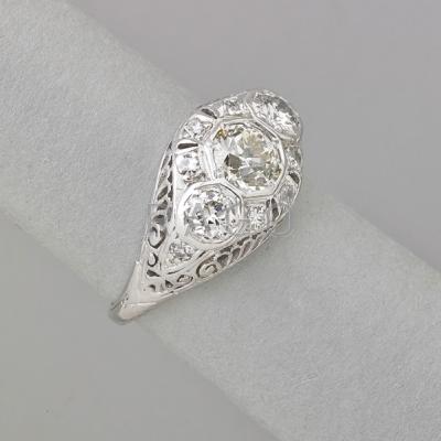 Appraisal: ART DECO DIAMOND PLATINUM RING Three-stone pierced lateral bombe with