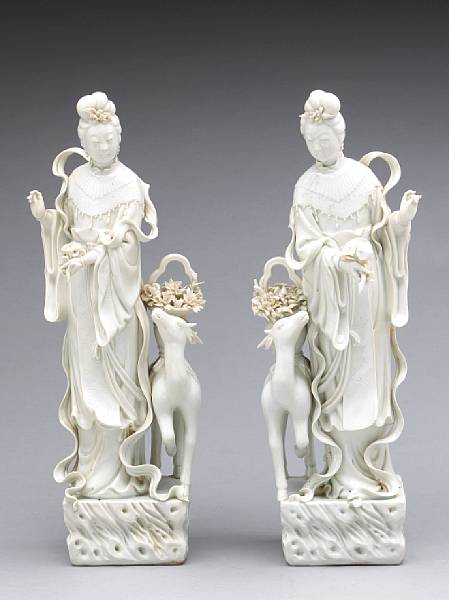 Appraisal: A pair of Dehua porcelain female immortals Late Qing Republic