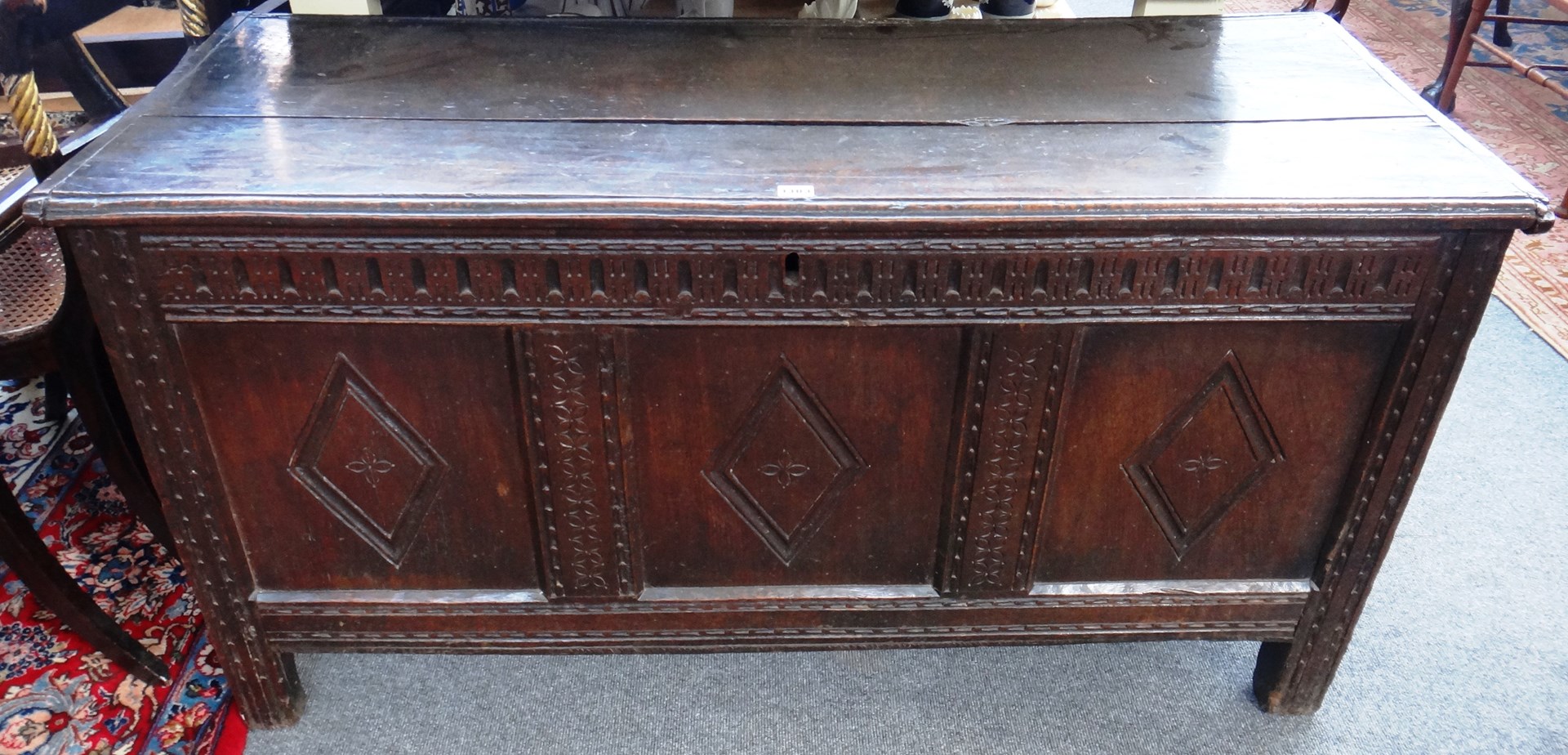 Appraisal: A th century oak coffer with triple panel front on