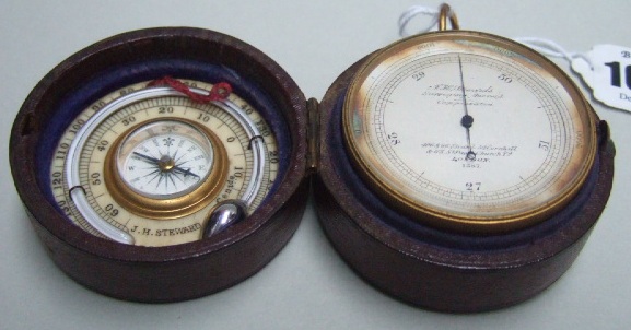 Appraisal: A travelling gilt metal circular cased aneroid barometer with a