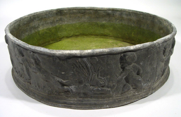 Appraisal: Circular lead planter with exterior cast with a continuous band