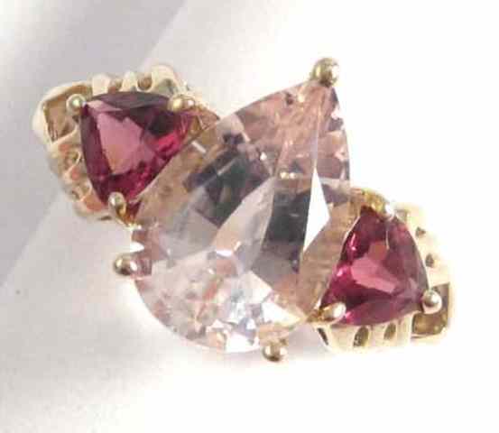 Appraisal: ROSE QUARTZ AND PINK TOURMALINE RING k yellow gold with