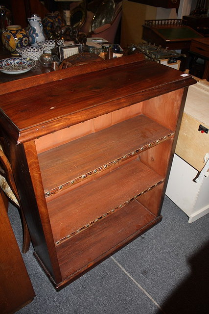 Appraisal: A VICTORIAN MAHOGANY OPEN BOOKCASE with two shelves and platform