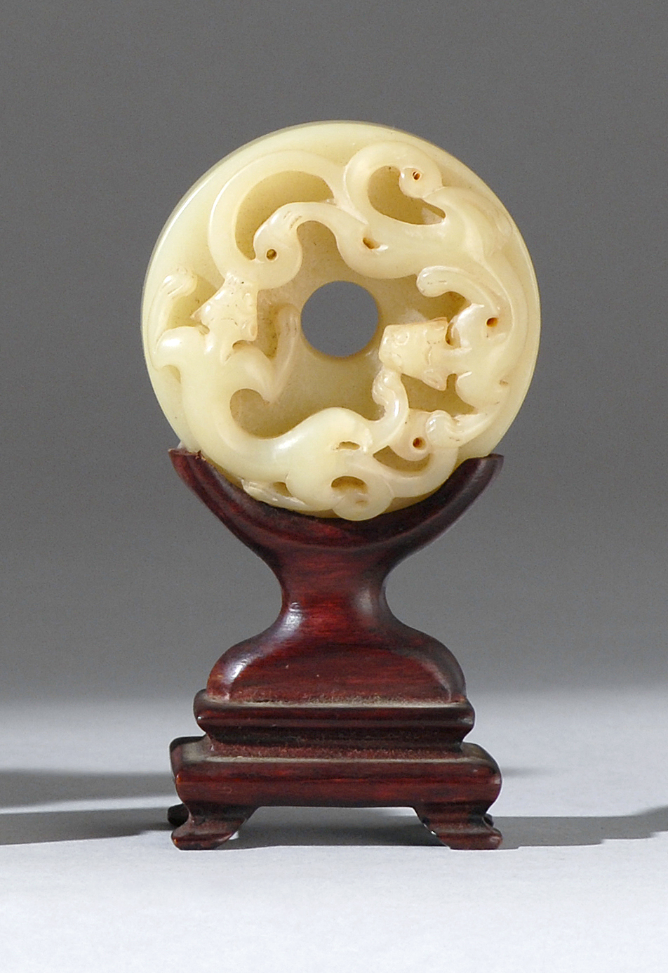 Appraisal: YELLOW JADE BI th CenturyWith relief qilong dragon design on