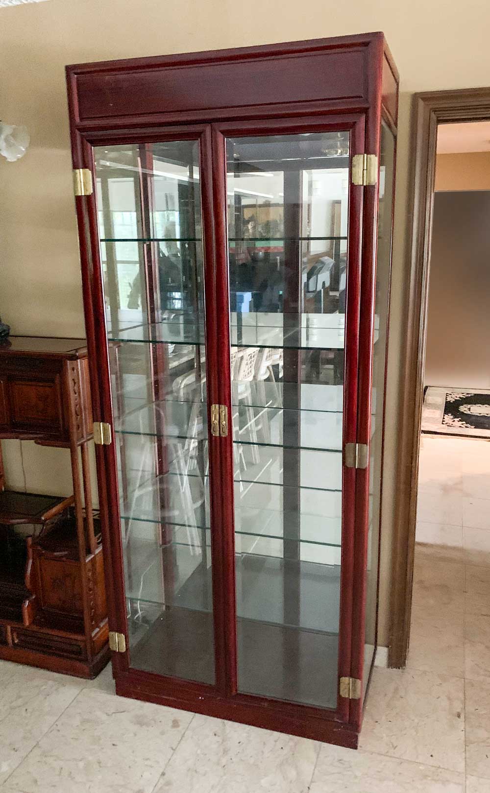 Appraisal: CHINESE MIRROR BACK CURIO CABINET door Chinese display cabinet having