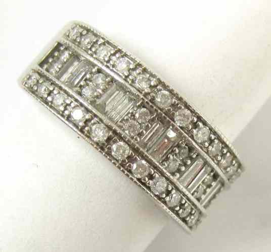 Appraisal: DIAMOND AND FOURTEEN KARAT GOLD RING set with round-cut and