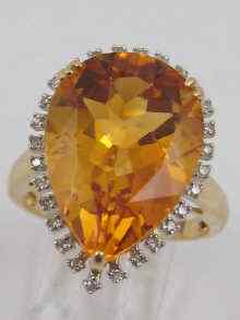 Appraisal: A yellow metal tests ct gold citrine and diamond ring