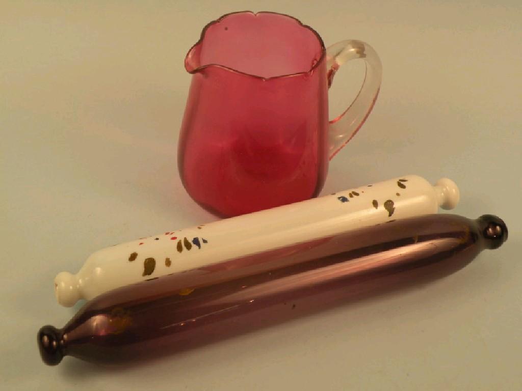 Appraisal: A Victorian cranberry tinted jug a white opaque rolling pin