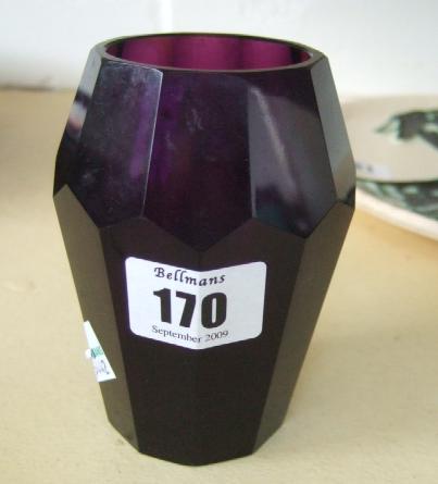 Appraisal: A magenta cut glass vase of faceted form possibly by