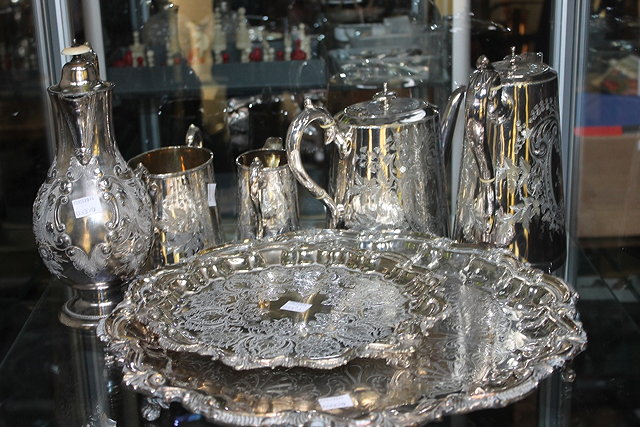 Appraisal: A VICTORIAN SILVER PLATED FOUR PIECE TEA SET with loop