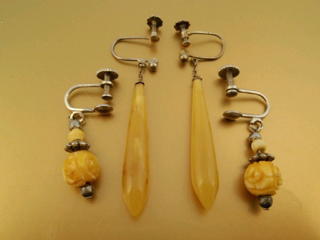 Appraisal: Two pairs of natural stone pendant drop earrings