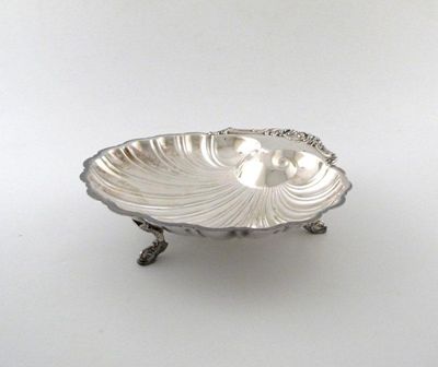 Appraisal: An electroplated shell serving dish foliate and shell handle engraved