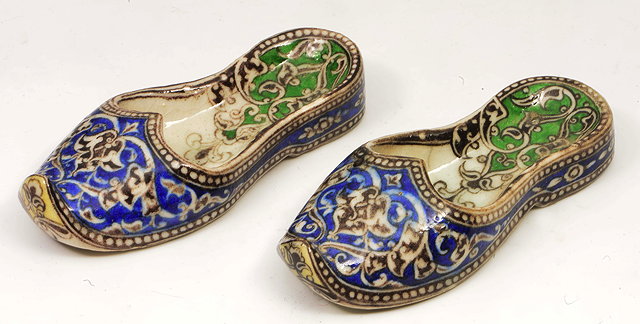 Appraisal: A PAIR OF LATE TH CENTURY QUAJAR POTTERY SLIPPERS each