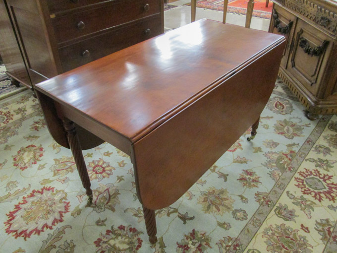 Appraisal: LATE VICTORIAN DROP-LEAF CHERRY DINING TABLE American late th century