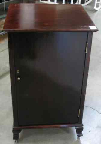 Appraisal: MAHOGANY MUSIC CABINET American c the door opening to a