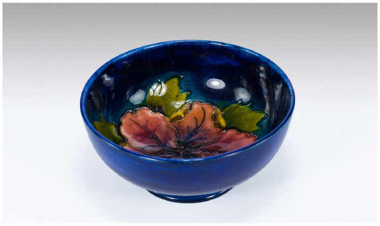 Appraisal: Moorcroft Footed Bowl Hibiscus design on blue ground marks to