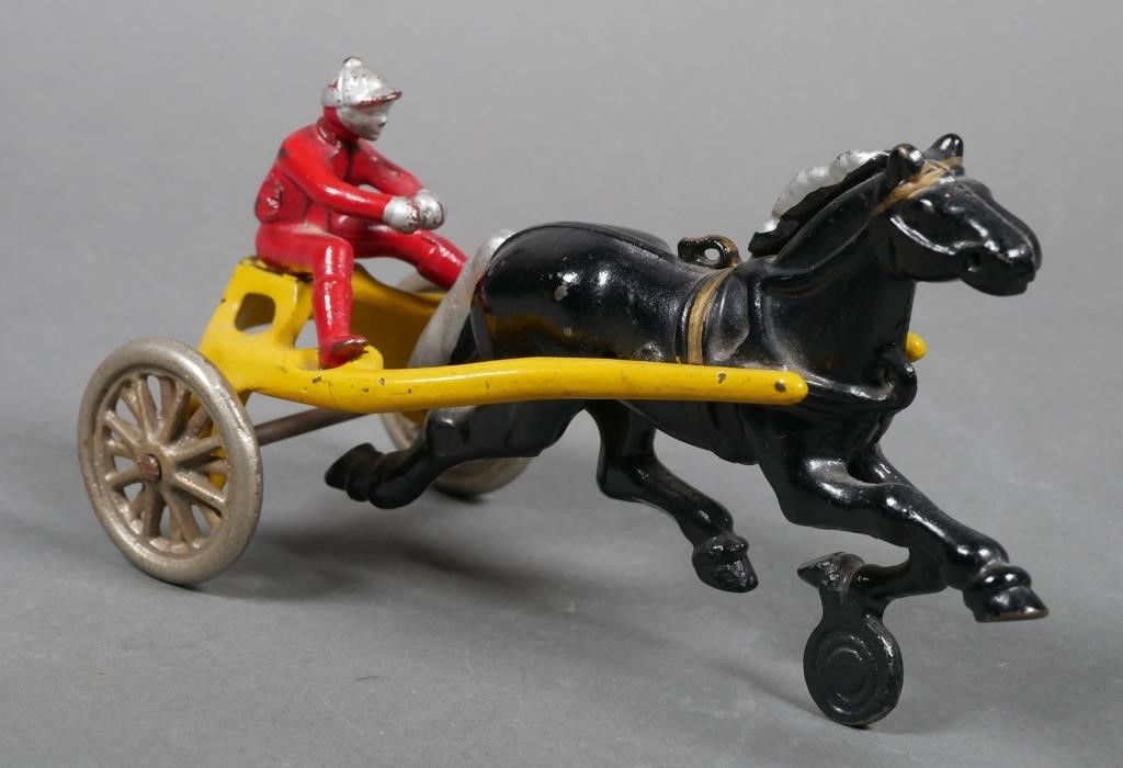 Appraisal: Kenton cast iron race horse drawn sulky with jockey rider