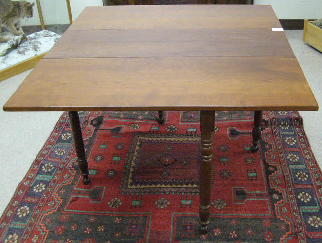 Appraisal: VICTORIAN DROP-LEAF CHERRYWOOD DINING TABLE American c the narrow table